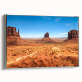 Framed canvas of Monument Valley with vibrant sunset hues, ideal for adding a colorful touch to a modern living room.