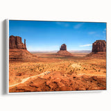 Vintage poster art of Monument Valley on framed canvas, featuring earthy tones, ideal for living room decor.