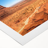 Art deco poster of Monument Valley in muted earth tones on a rolled canvas, suitable for dining room decor.