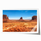 Monument Valley landscape on rolled print, featuring earthy red and orange tones, suitable for art wall dining room.