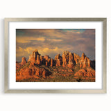 Textured abstract art print of Sedona, Arizona in muted earth tones on a framed canvas, ideal for bedroom decor.