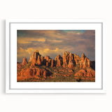 Abstract art print of Sedona landscape in muted earth tones on a framed white mat, suitable for bedroom or dining room decor.
