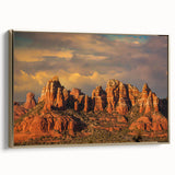 Framed canvas featuring a vintage-style landscape painting of Sedona, Arizona, in muted earth tones.