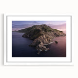 Abstract art print of Catalina Island in muted blue and green tones on a framed white mat, suitable for dining room decor.