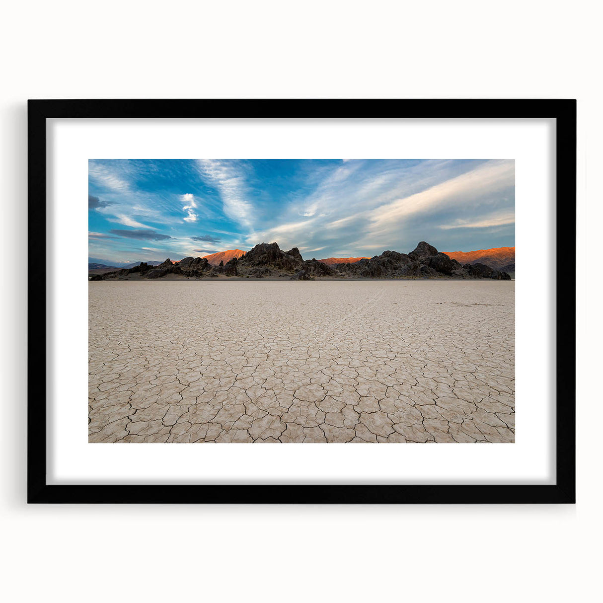 Extra large abstract art print of Death Valley with vibrant colors and textured details on a framed black mat.