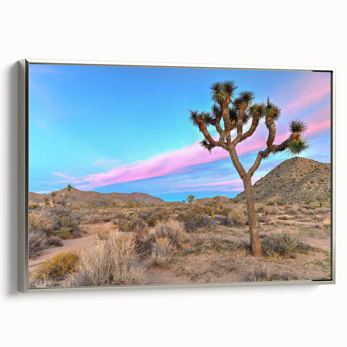 Framed canvas featuring a Joshua Tree landscape in muted earth tones, ideal for adding a vintage touch to living room decor.