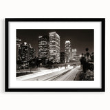 Extra large abstract art print of Los Angeles skyline in vibrant, colorful hues on a black framed canvas.