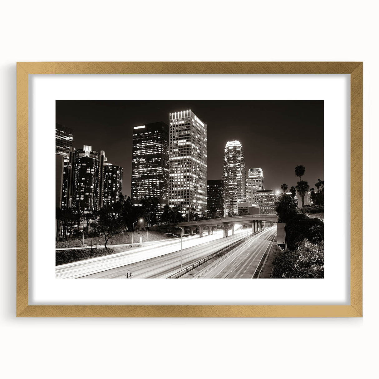 Extra large abstract art print of Los Angeles skyline in muted gold and blue tones on a framed canvas.