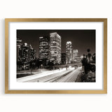 Extra large abstract art print of Los Angeles skyline in muted gold and blue tones on a framed canvas.