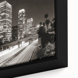 Extra large framed canvas of a textured Los Angeles skyline in black with colorful accents, ideal for living room decor.