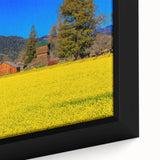 Close-up of a textured black wall art depicting California's Napa Valley on a framed canvas, with vibrant, colorful accents.