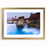 Extra large abstract art print depicting San Diego scenery in textured hues of blue and gold, framed with a gold mat.