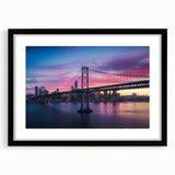 Abstract art print of San Francisco skyline in vibrant, colorful hues on a large, framed canvas, ideal for living room decor.