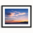 Abstract art print of Santa Monica scenery in vibrant colors on a black framed canvas, ideal for living room decor.