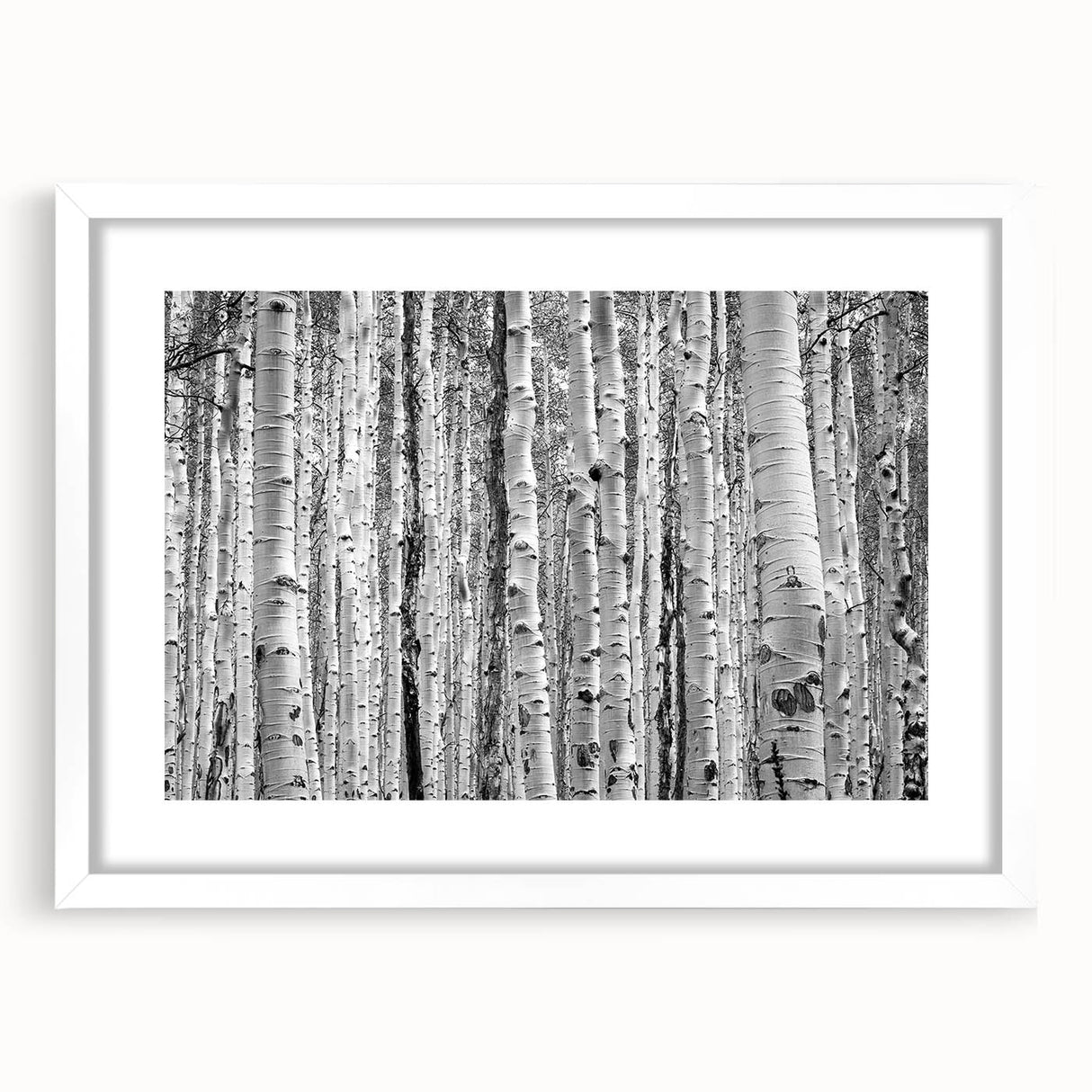Abstract art print of a mountain scenery in cool blue and white, framed with a white mat, suitable for dining room decor.