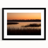 Abstract art print with vibrant, colorful patterns on a textured canvas, framed in black, suitable for living room decor.