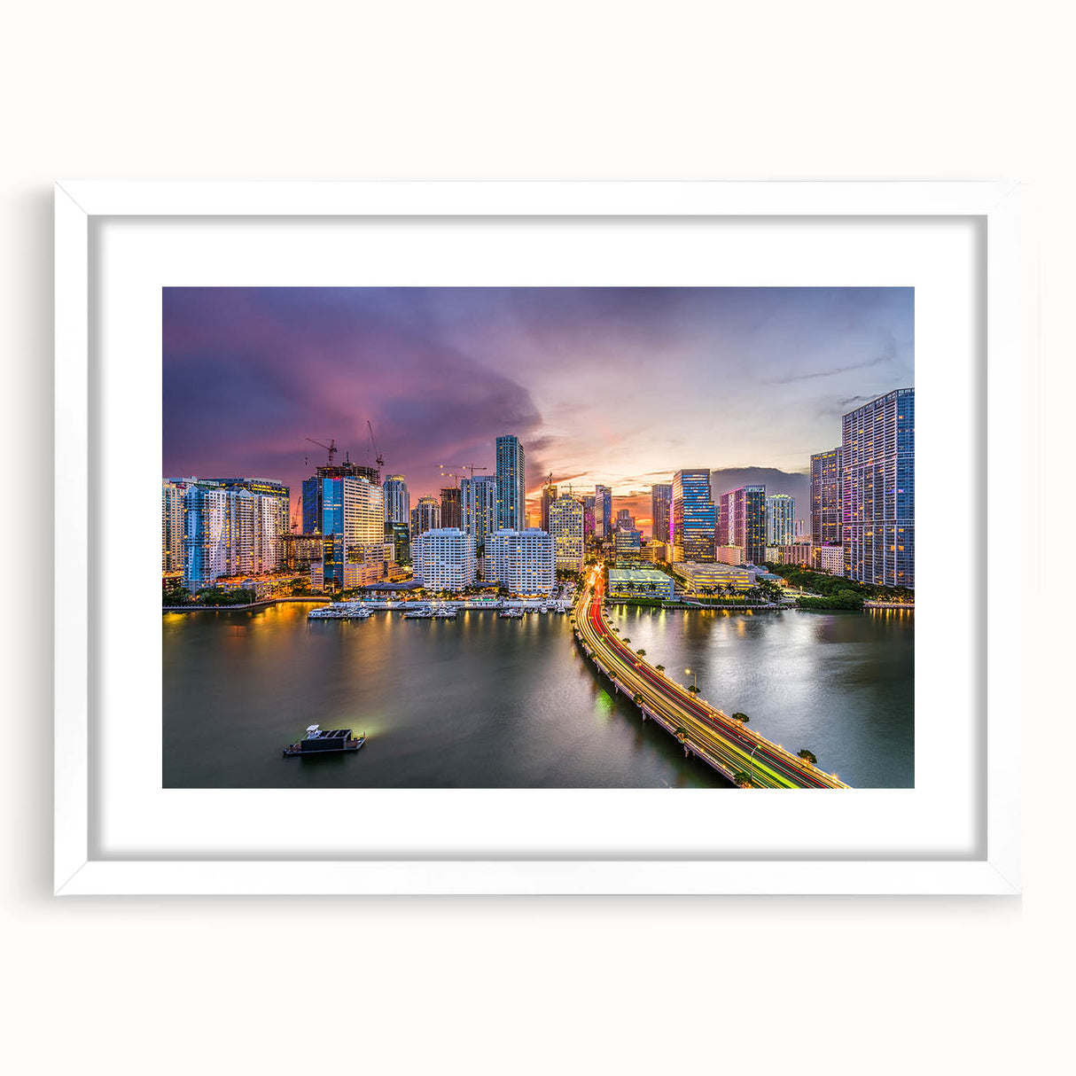 Abstract art print of Miami skyline in muted blue and pink tones on a framed canvas, suitable for dining room decor.
