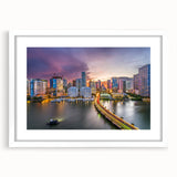 Abstract art print of Miami skyline in muted blue and pink tones on a framed canvas, suitable for dining room decor.