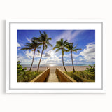 Abstract art print of Palm Beach with soft blue and peach tones on a white framed canvas.