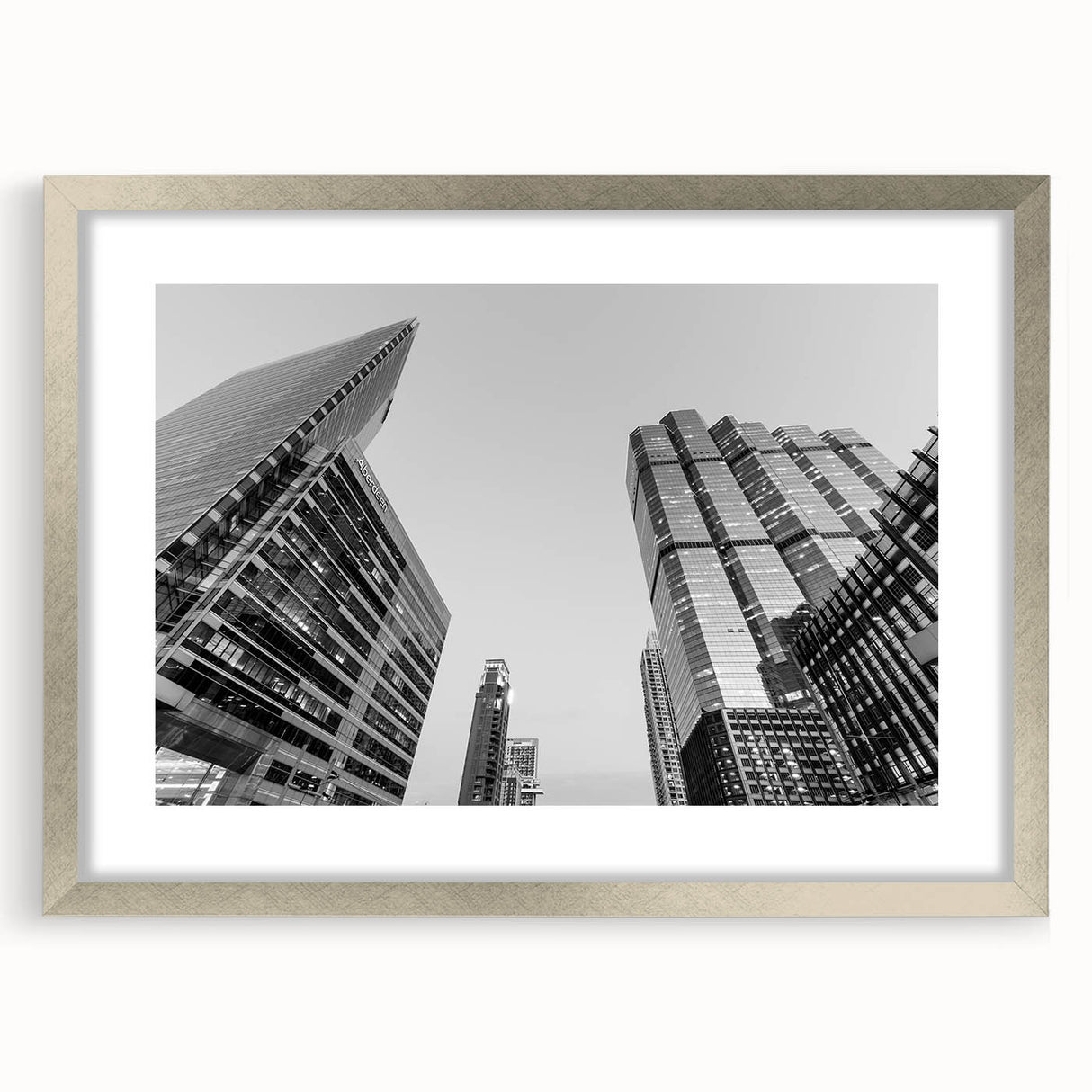 Textured abstract art print of Atlanta skyline in muted gray tones, framed in silver, ideal for bedroom art.