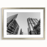 Textured abstract art print of Atlanta skyline in muted gray tones, framed in silver, ideal for bedroom art.