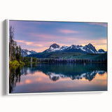 Vintage poster art of Idaho scenery on framed canvas, featuring colorful imagery against a black background.
