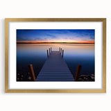 Extra large abstract art print of Lake Michigan, featuring textured blues and grays, in a gold frame.