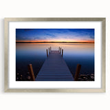 Textured art depicting abstract Lake Michigan in muted blue and gray tones, framed with a silver mat.