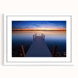 Abstract art print of Lake Michigan with muted blue and gray tones on a framed white mat.