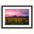 Colorful abstract art print depicting a textured Kansas landscape, in a black frame with mat.