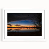 Abstract art print of Louisiana scenery in muted earth tones on a white framed canvas, suitable for dining room decor.