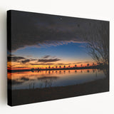 Landscape painting of a Louisiana bayou on stretched canvas, featuring muted green and blue tones.