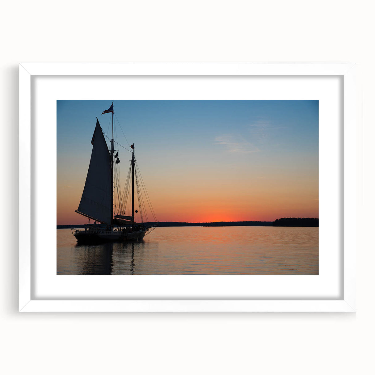 Abstract art print of Maine scenery in muted blue and green shades, framed with a white mat, suitable for dining room decor.