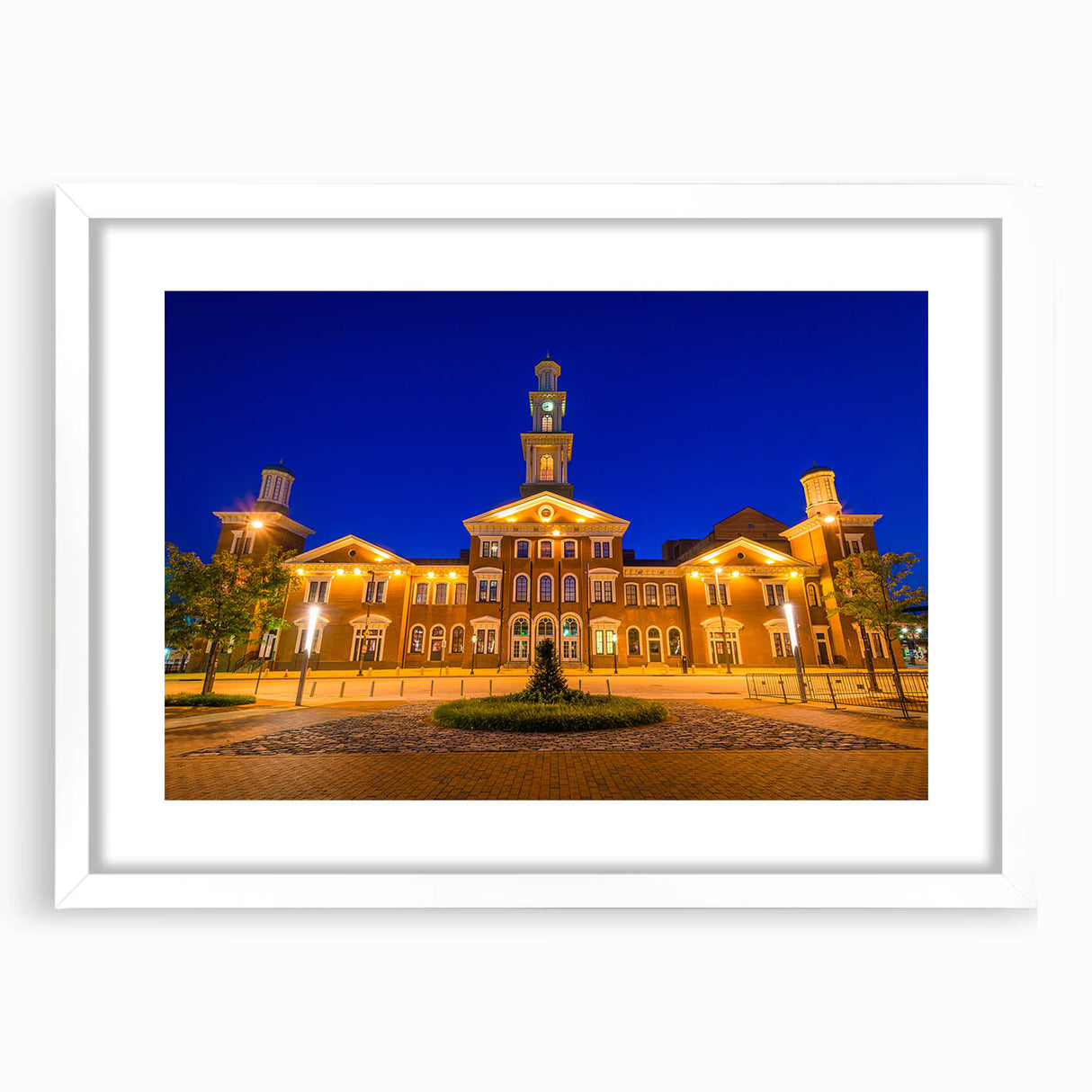 Abstract art print of Baltimore skyline in muted gray and blue tones on a framed white mat, suitable for dining room decor.