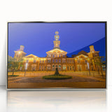 Mid-century modernist art depicting Baltimore skyline in muted gray and blue tones on a framed acrylic print.
