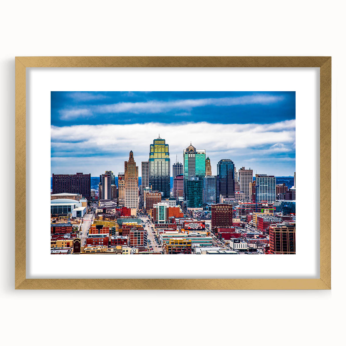 Extra large abstract art print of Kansas City skyline in muted gold and gray tones on a framed canvas.