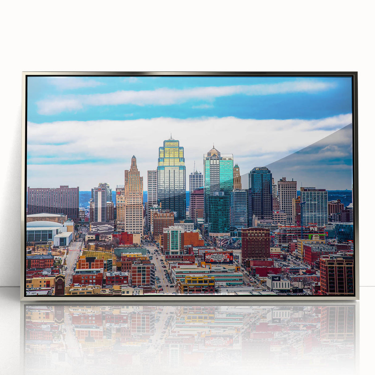 Mid-century modernist art of Kansas City skyline in muted gray and blue tones on a framed acrylic print.