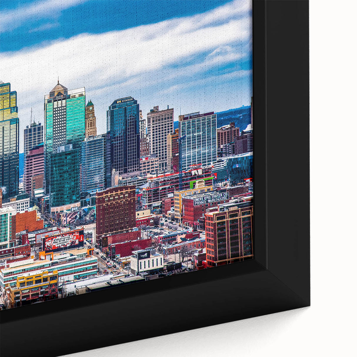 Extra large framed canvas featuring a textured depiction of the Kansas City skyline in black with colorful art accents.