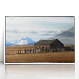Acrylic print of a serene Montana landscape in muted earth tones, framed in white.
