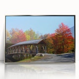 Mid-century modernist art depicting New Hampshire scenery in muted earth tones on a silver-framed acrylic print.