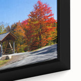 Extra large framed canvas featuring a textured depiction of a New Hampshire landscape in black with colorful accents.