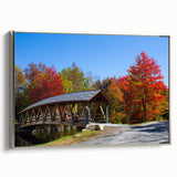Framed canvas featuring a vintage-style landscape art painting of New Hampshire, with vibrant colors on a black background.
