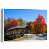 Vintage poster art of New Hampshire scenery on a framed canvas, featuring vibrant colorful art with black accents.