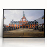 Large abstract wall art depicting a mid-century modernist scene in vibrant orange and blue tones, framed in black acrylic.