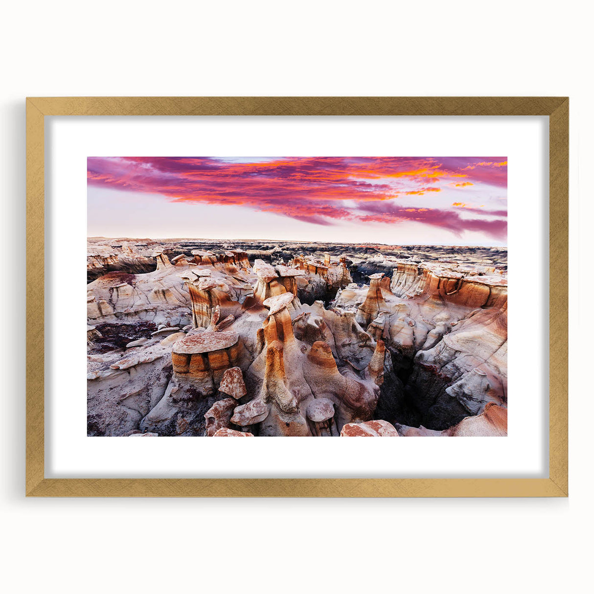 Extra large abstract art print depicting a textured scenery of New Mexico in muted earth tones, framed in gold.