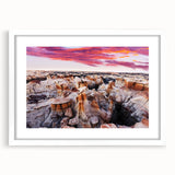Abstract art print depicting New Mexico scenery in muted earth tones on a framed white mat.
