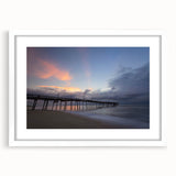 Abstract art print of the Outer Banks in North Carolina, featuring muted blue and gray tones on a framed white mat.