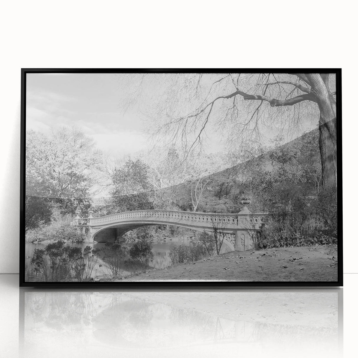 Large abstract wall art of Central Park in muted green and brown tones, framed in black acrylic.