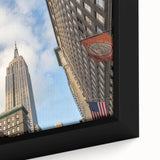 Extra large framed canvas of the NYC Empire skyline in black with colorful, textured accents, ideal for living room decor.