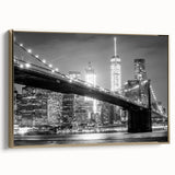 Framed canvas wall art featuring a vintage-style Manhattan Bridge landscape in black and gold tones, ideal for bedroom decor.
